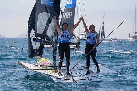 Odile van Aanholt and Annette Duetz celebrate winning the gold medal in women's skiff race